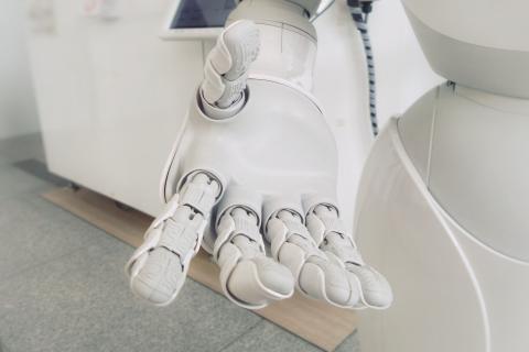 Image of a robotic hand symbolising AI which the article is about