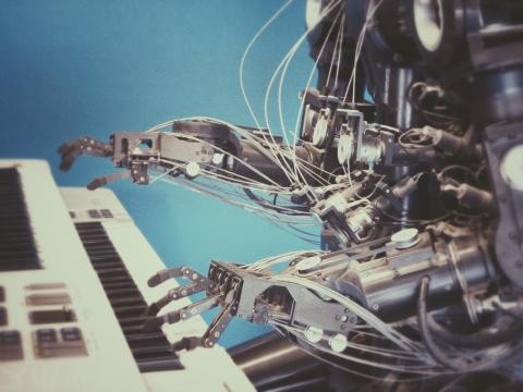 Image of a robot playing a piano