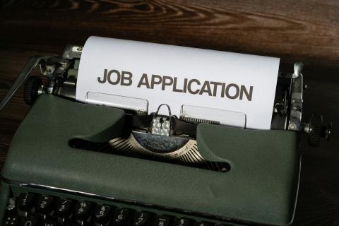 Image of a type writer with the words job application